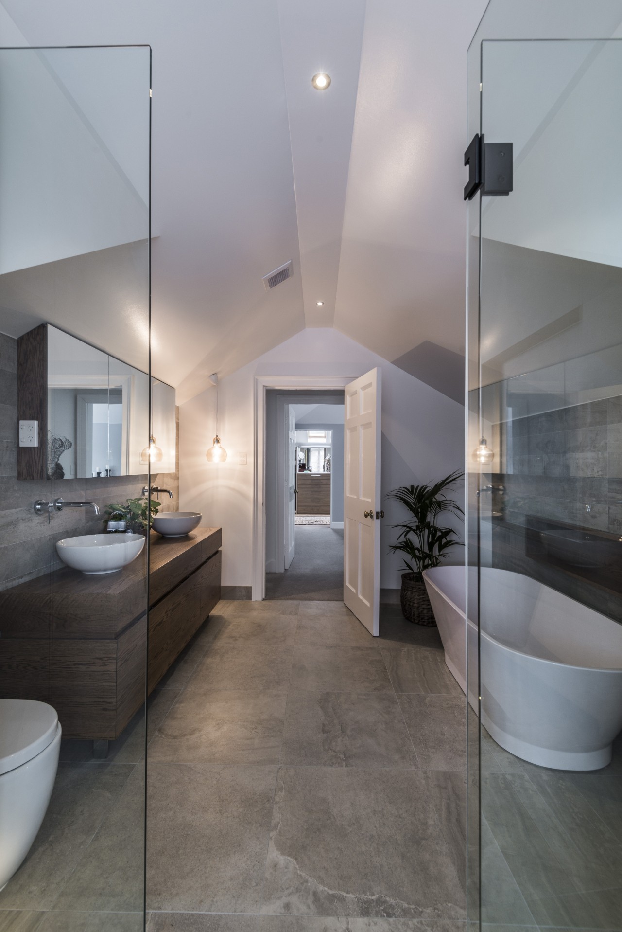 While the shower cubicle is slotted into an architecture, bathroom, ceiling, daylighting, floor, flooring, home, interior design, real estate, room, tile, wood flooring, gray