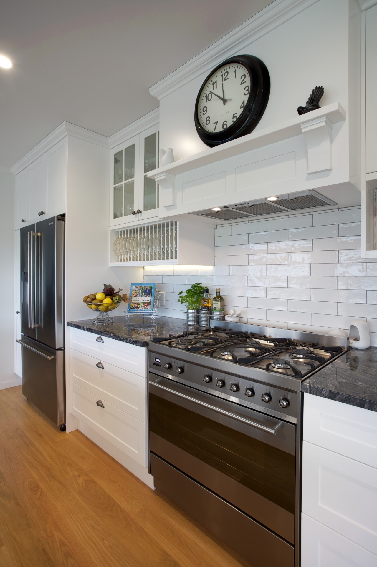 Open, breezy and welcoming, this kitchen designed by cabinetry, countertop, cuisine classique, floor, home, home appliance, interior design, kitchen, kitchen appliance, kitchen stove, room, gray