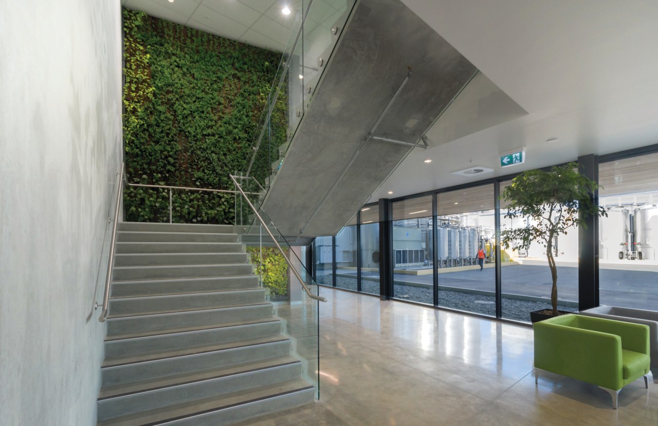 Green and growing a living wall greets visitors architecture, daylighting, glass, handrail, house, interior design, real estate, structure, window, gray