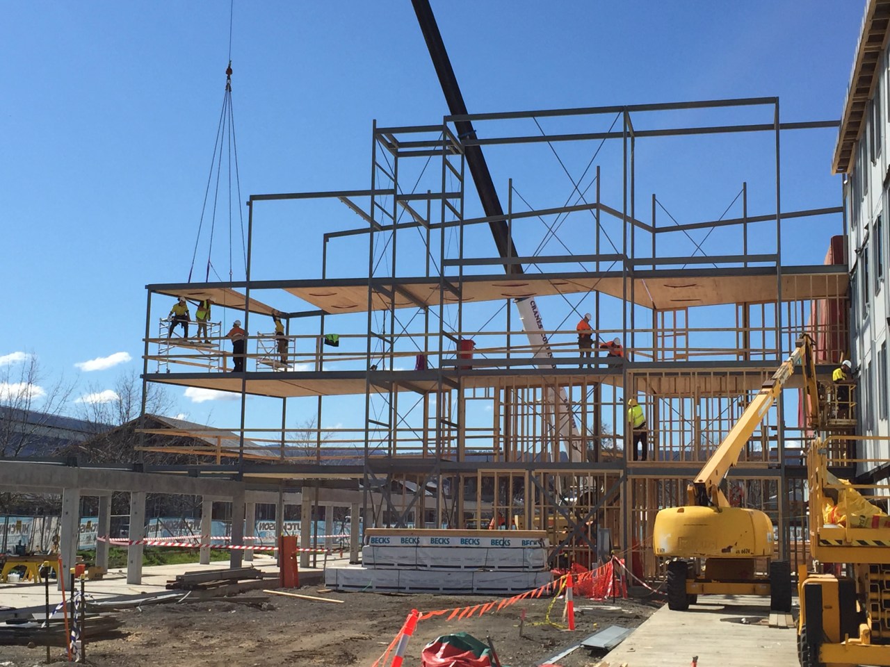 This University of Tasmania campus building uses a construction, scaffolding, structure, teal