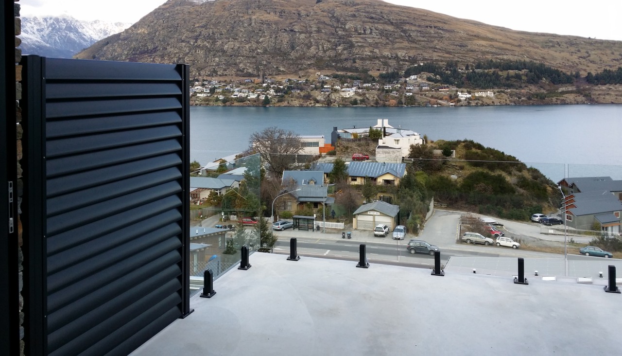 Privacy screens  between decks on this projectwere property, real estate, roof, sea, sky, town, gray, black