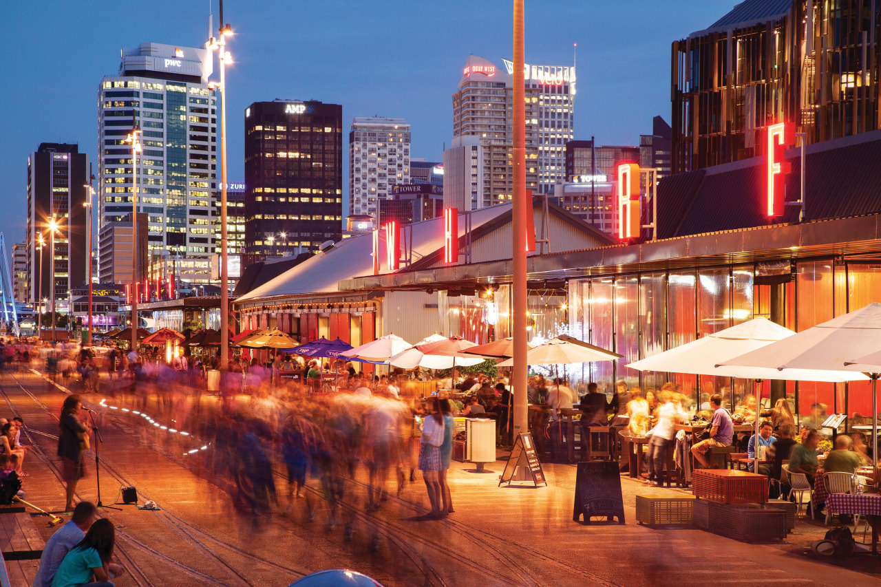 Residents at Wynyard Quarter have access to a city, cityscape, downtown, evening, metropolis, metropolitan area, mixed use, night, sky, skyline, skyscraper, town, urban area, red