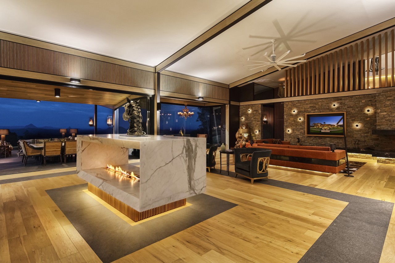 Kinetic sculpture this fireplace can be turned floor, flooring, interior design, real estate, wood, orange, brown