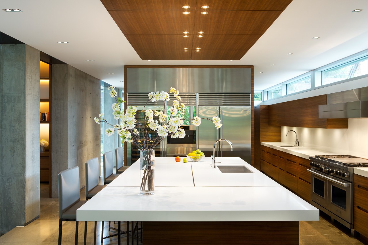 The main floor in this home is divided architecture, ceiling, countertop, house, interior design, kitchen, room, brown, white