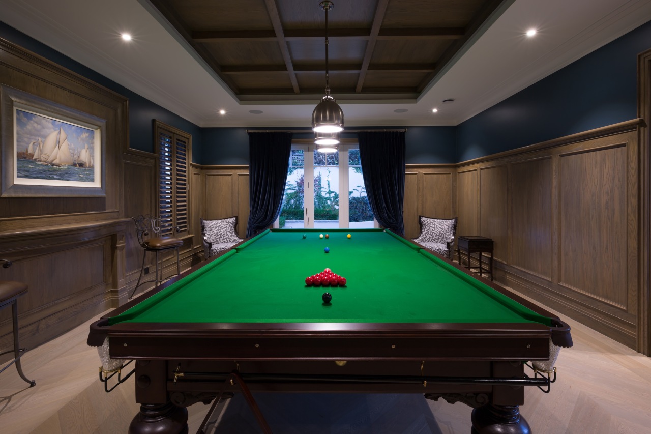 Ornate panelling seen on the ceiling and walls billiard room, billiard table, blackball pool, carom billiards, cue sports, english billiards, games, indoor games and sports, pocket billiards, pool, recreation room, room, snooker, table, black