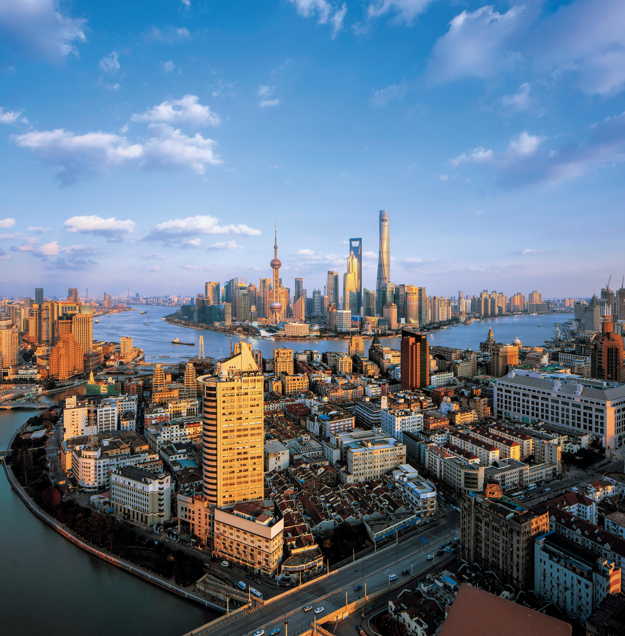 The Shanghai Tower became Chinas tallest and the aerial photography, bird's eye view, building, city, cityscape, daytime, downtown, horizon, landmark, metropolis, metropolitan area, reflection, sky, skyline, skyscraper, tower, tower block, urban area, teal, black