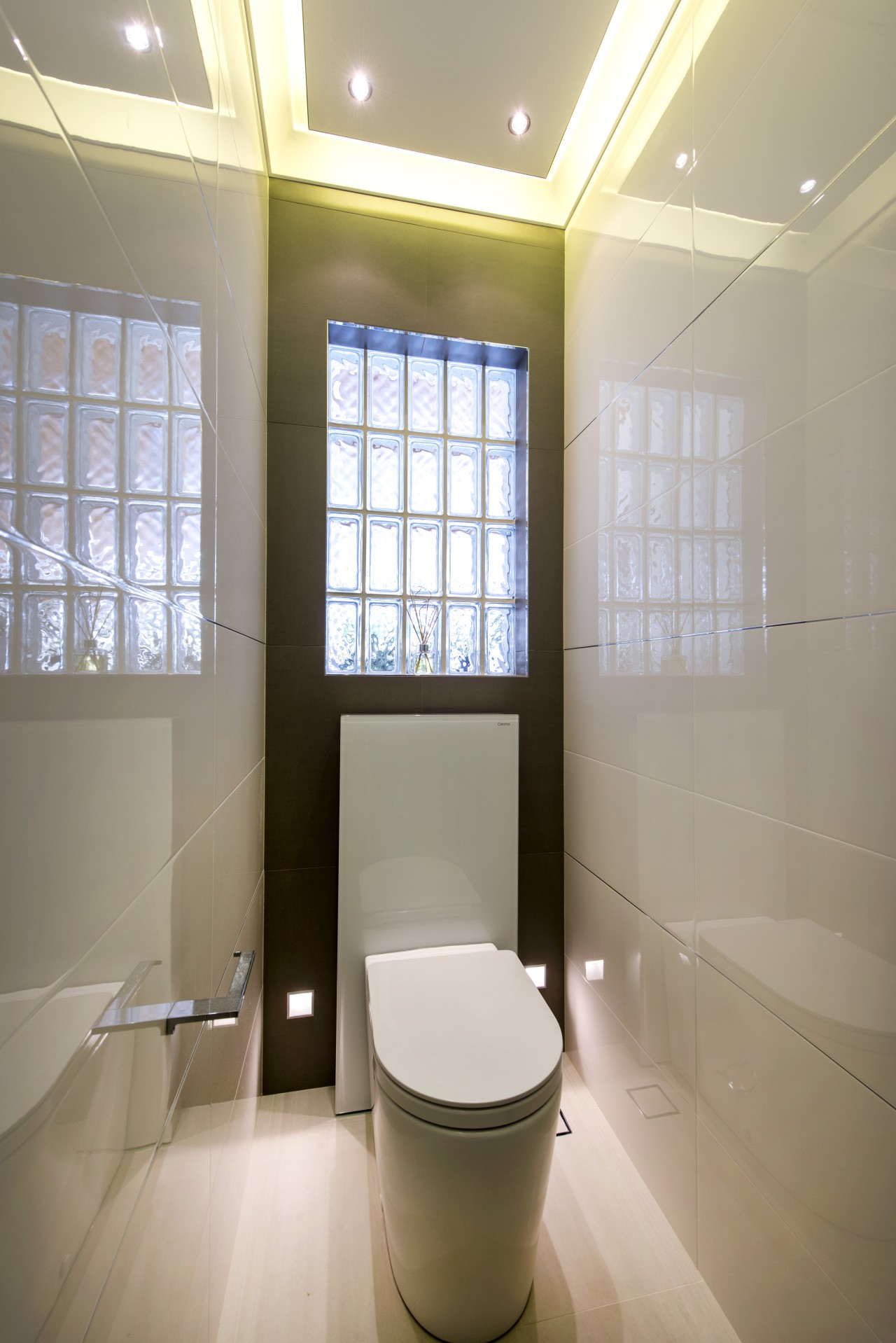 Multiple light sources bring this toilet space alive, architecture, bathroom, ceiling, daylighting, floor, home, interior design, plumbing fixture, room, toilet, toilet seat, window, gray