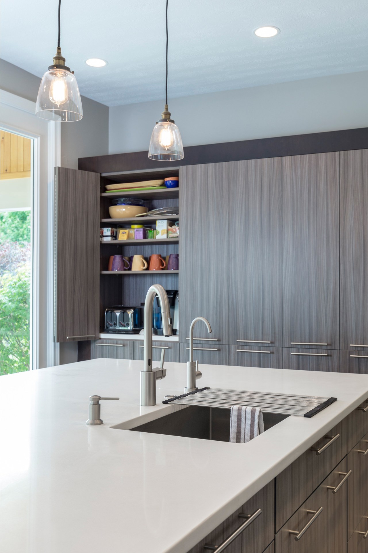 This kitchen by Lauren Levant Interior has an cabinetry, countertop, interior design, kitchen, gray