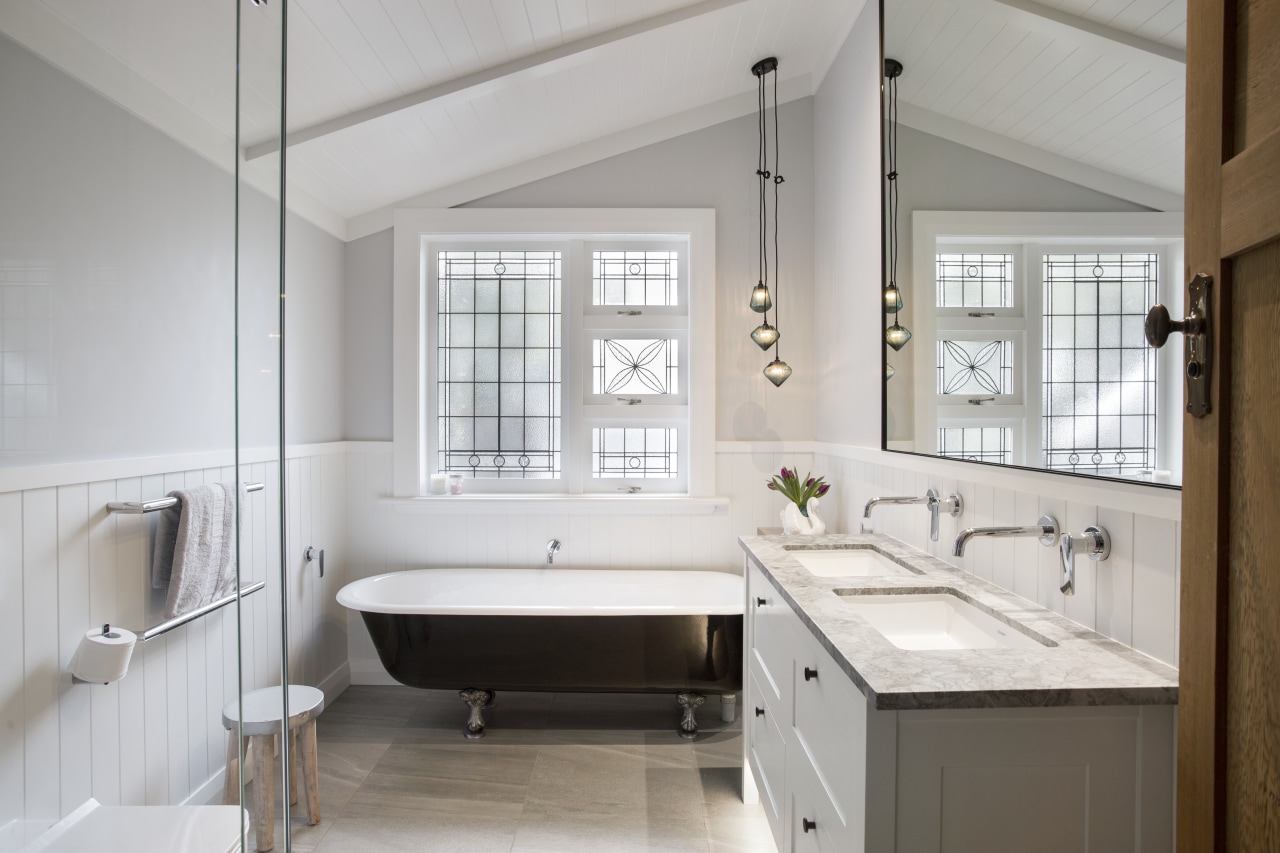 Designed Leonie von Sturmer, this bathroom balances a bathroom, bathroom accessory, countertop, floor, home, interior design, room, sink, window, gray