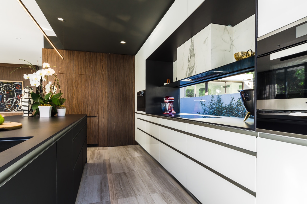 On this project by Pepper Design, the existing countertop, interior design, kitchen, black, white