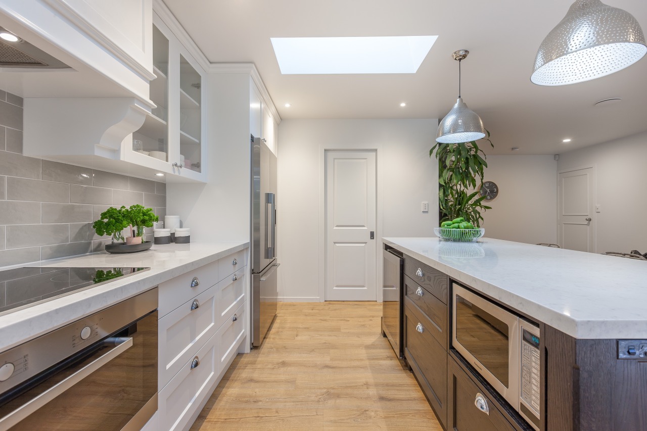 This kitchen renovation by designer Kira Gray offers cabinetry, countertop, home, interior design, kitchen, real estate, room, gray