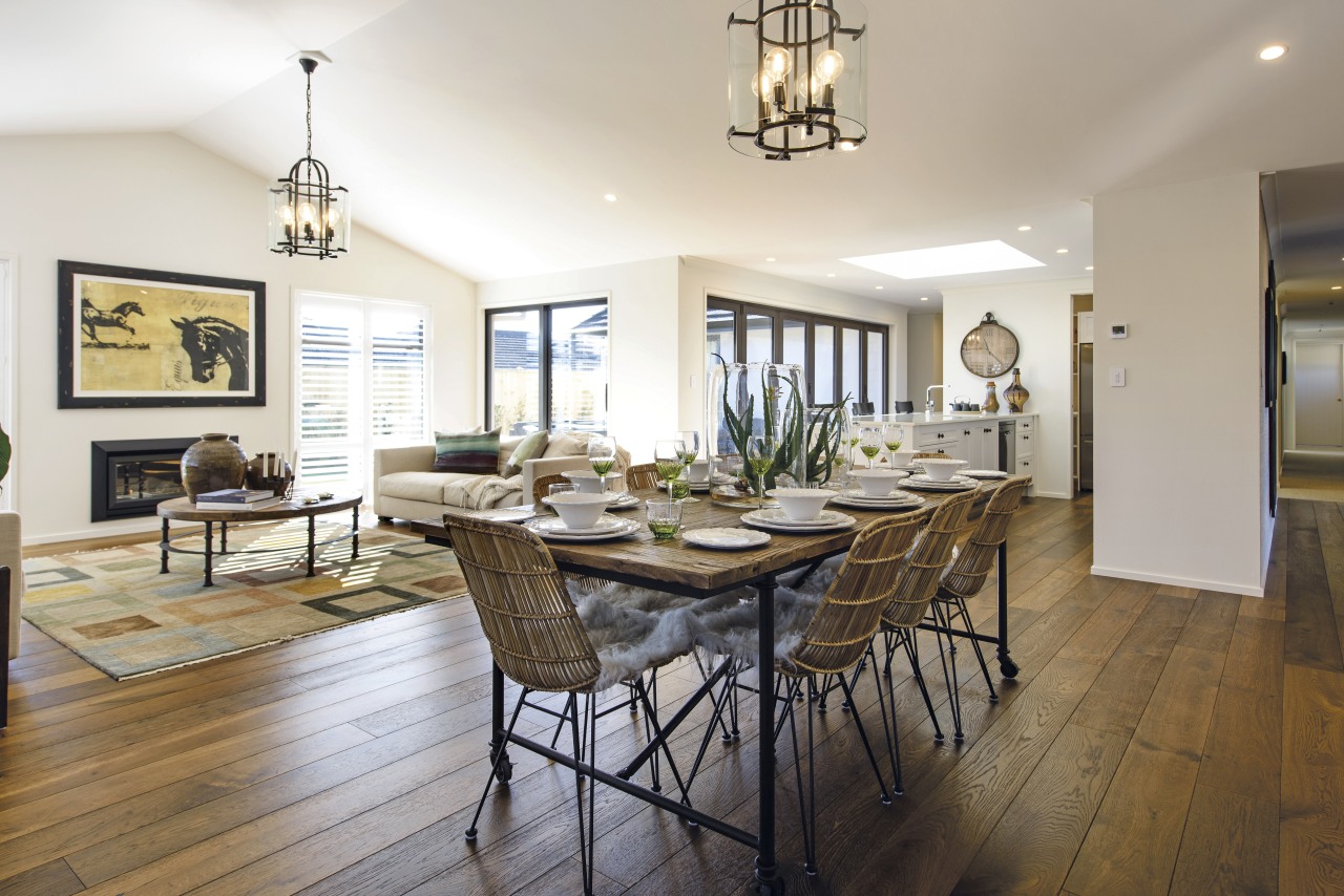 On the interior of this GJ Gardner showhome, dining room, estate, floor, flooring, hardwood, home, interior design, living room, property, real estate, room, table, white