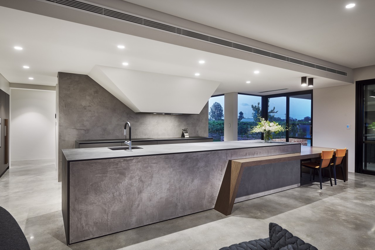 The kitchen's strong, sculptural nature extends to the 