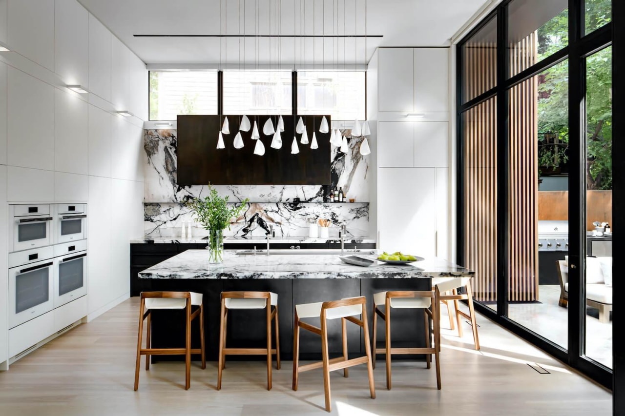 The contemporary kitchen with contemporary pendants to match. 