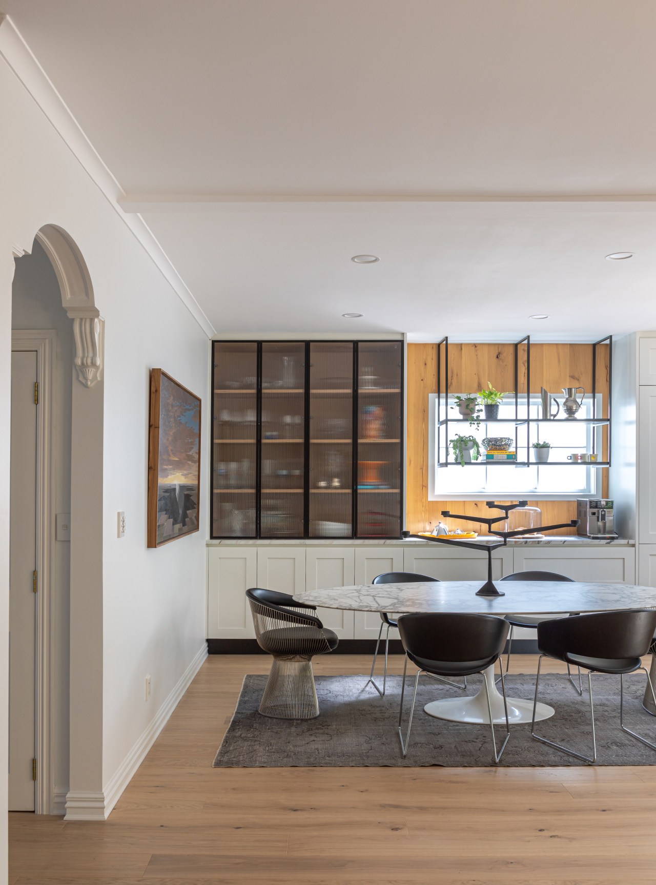 The hanging shelving in front of the window 