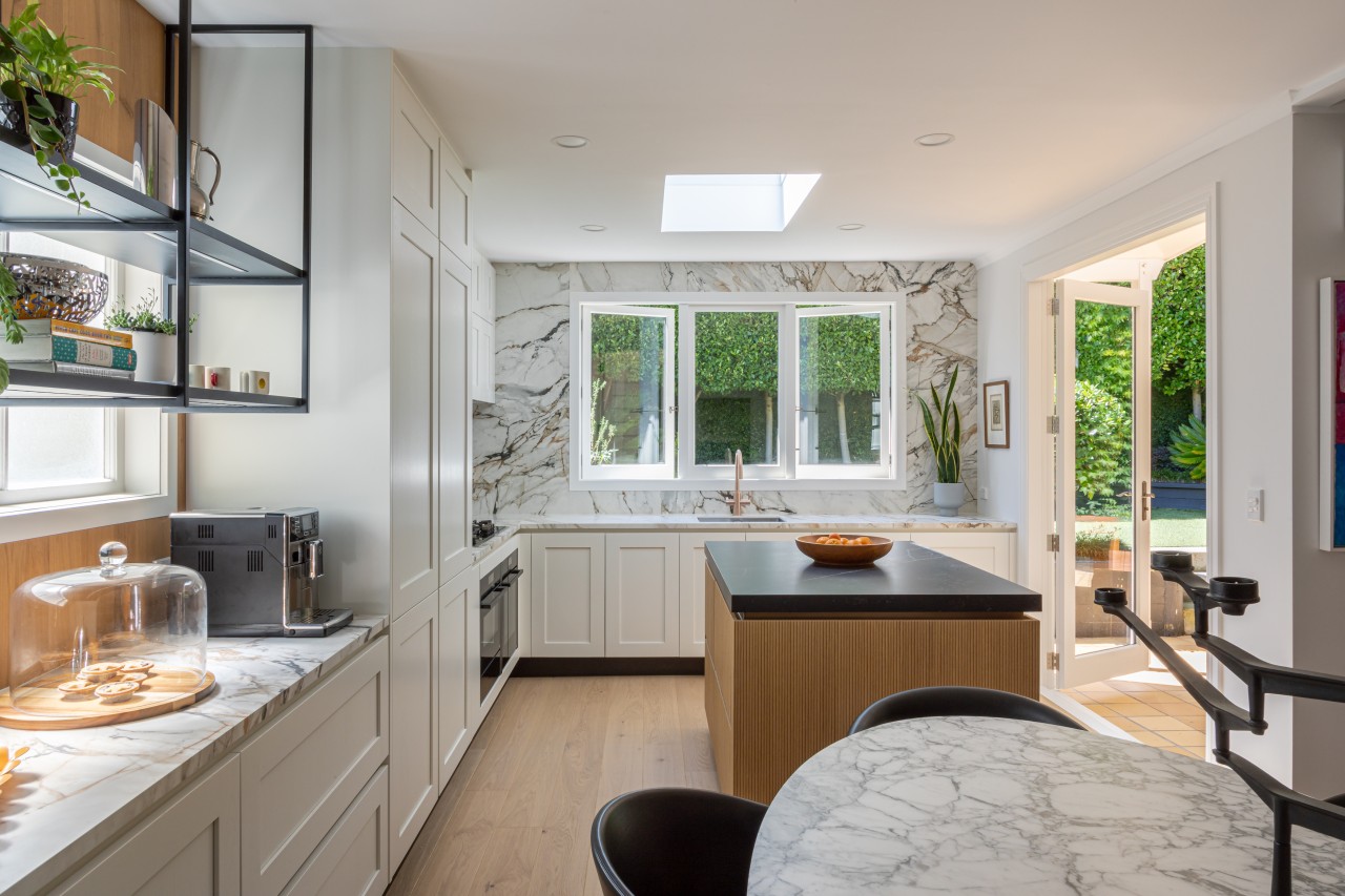 Kitchen storage now extends along the wall towards 