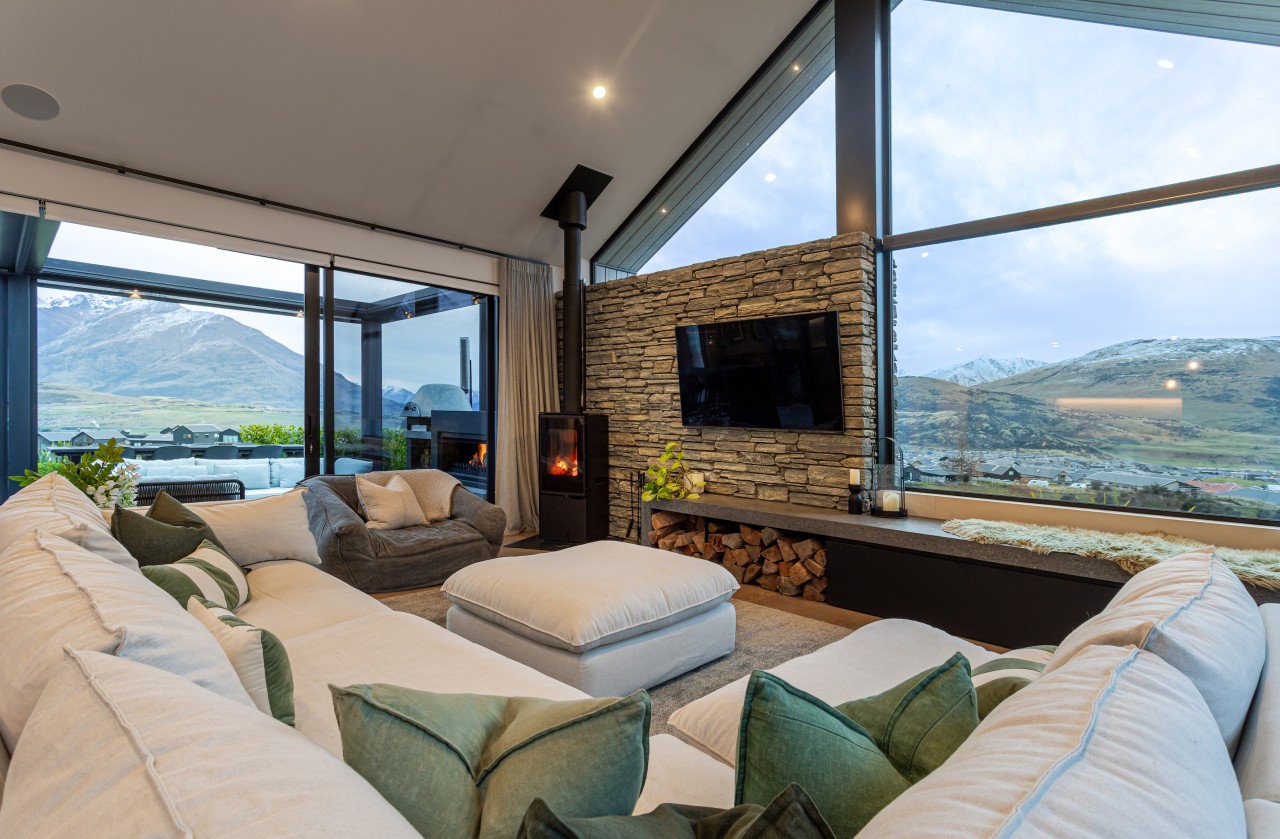 Lake and mountain views from the high-ceilinged living 