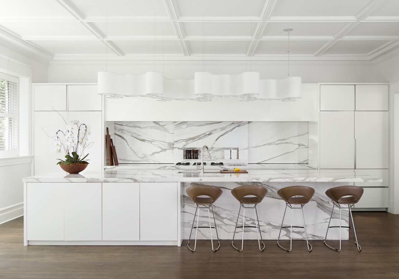 In the kitchen, a generously sized marble-topped island 