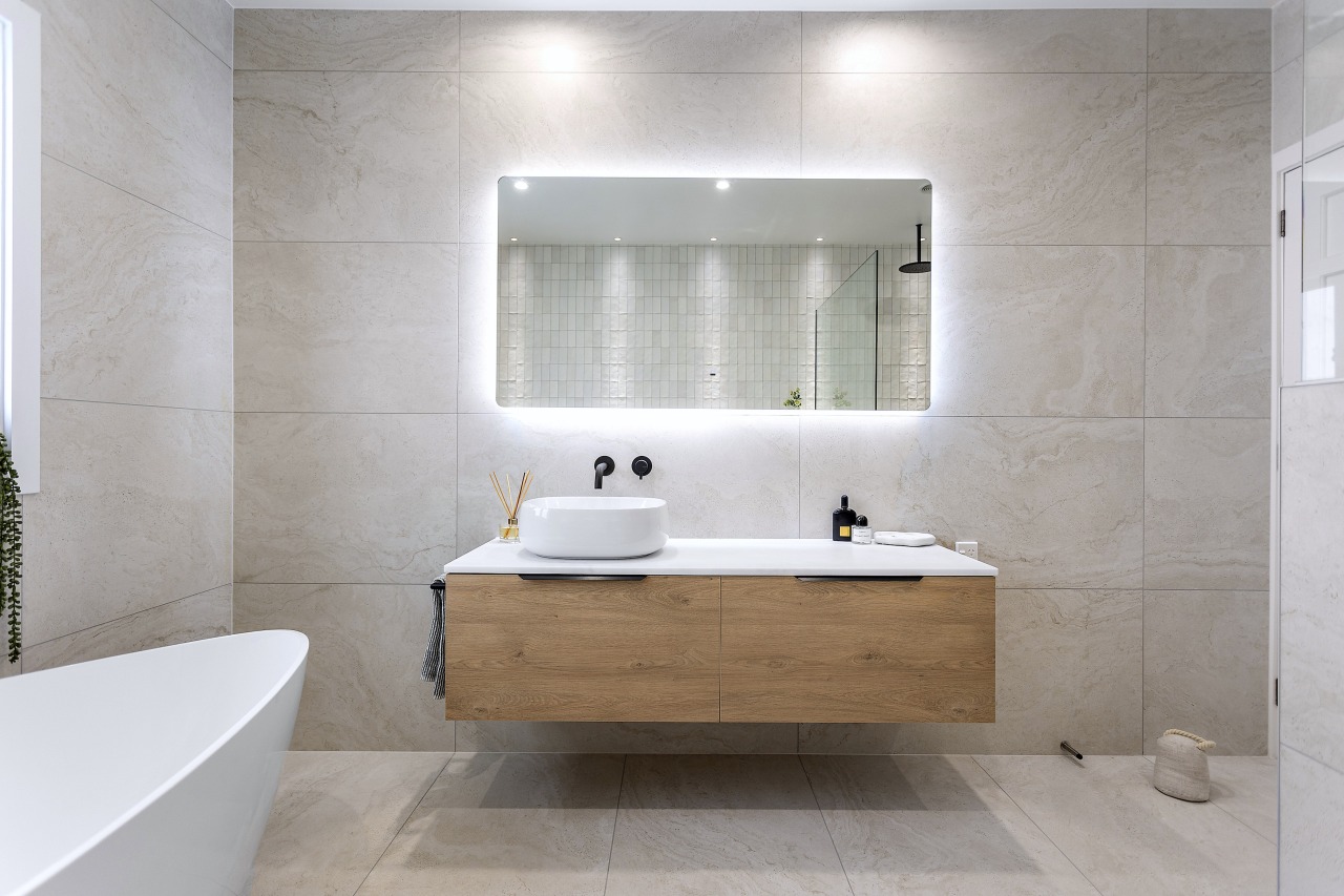 Both the wall-hung nature of the vanity and 