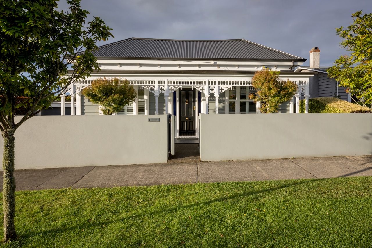 The front of this traditional villa was faithfully architecture, building, estate, facade, grass, home, house, lawn, mansion, property, real estate, residential area, roof, sky, tree, villa, yard, brown, gray