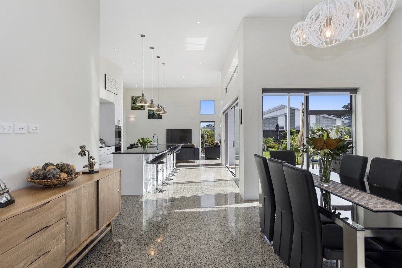 Soaring ceilings and an interior living zone that interior design, property, real estate, gray