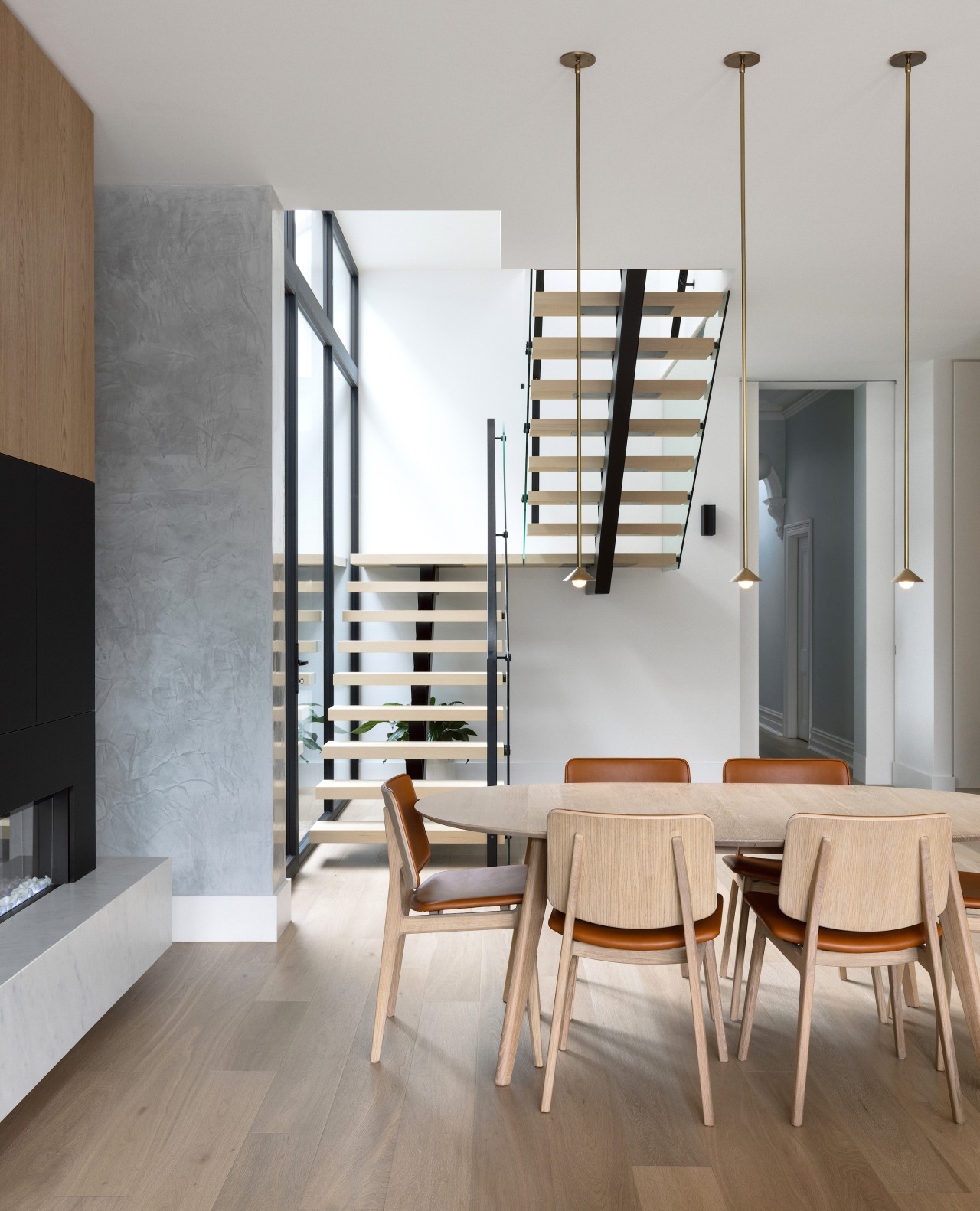 New central dining area beside contemporary fireplace. 