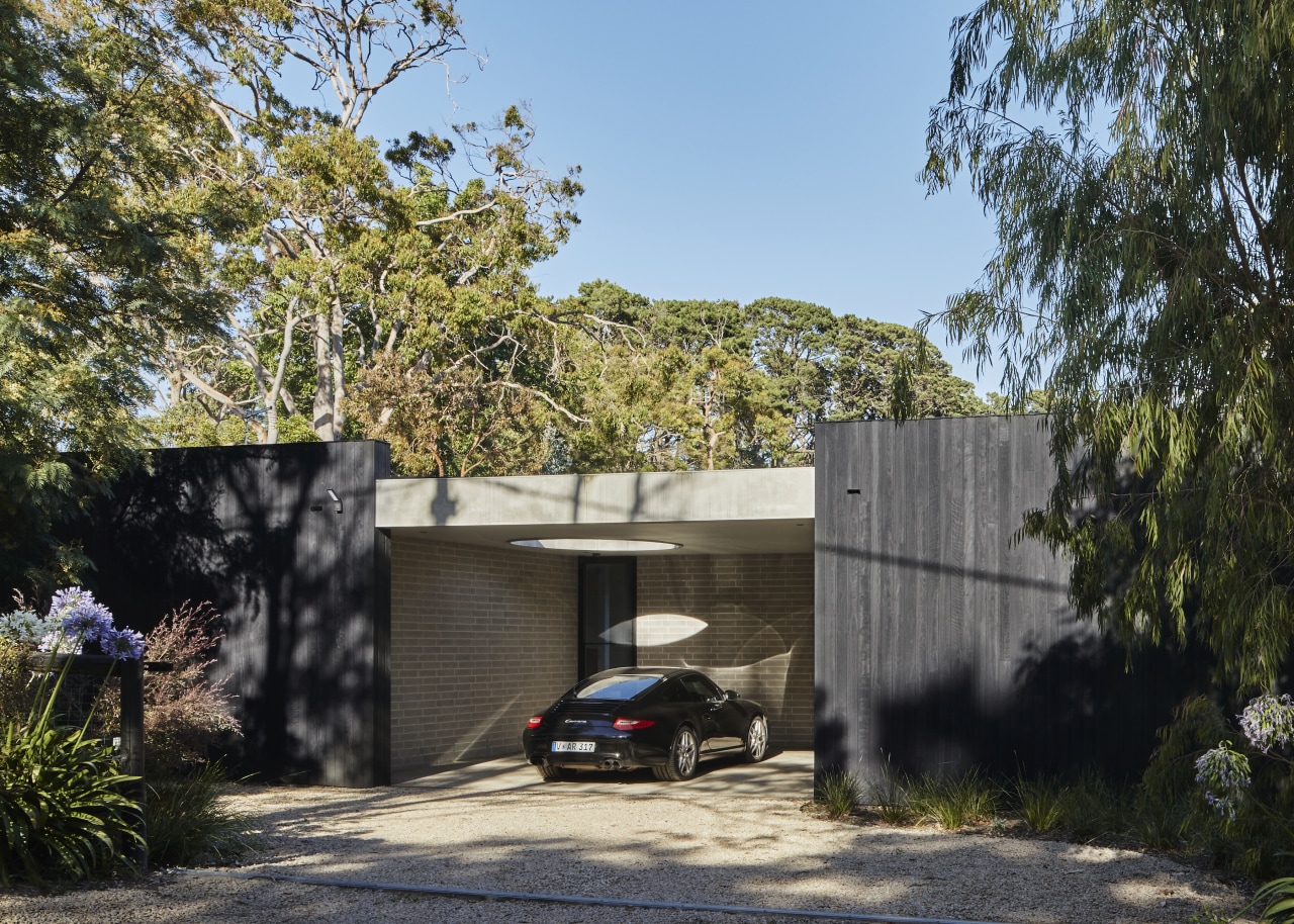 An aperture in the carport roof provides light 