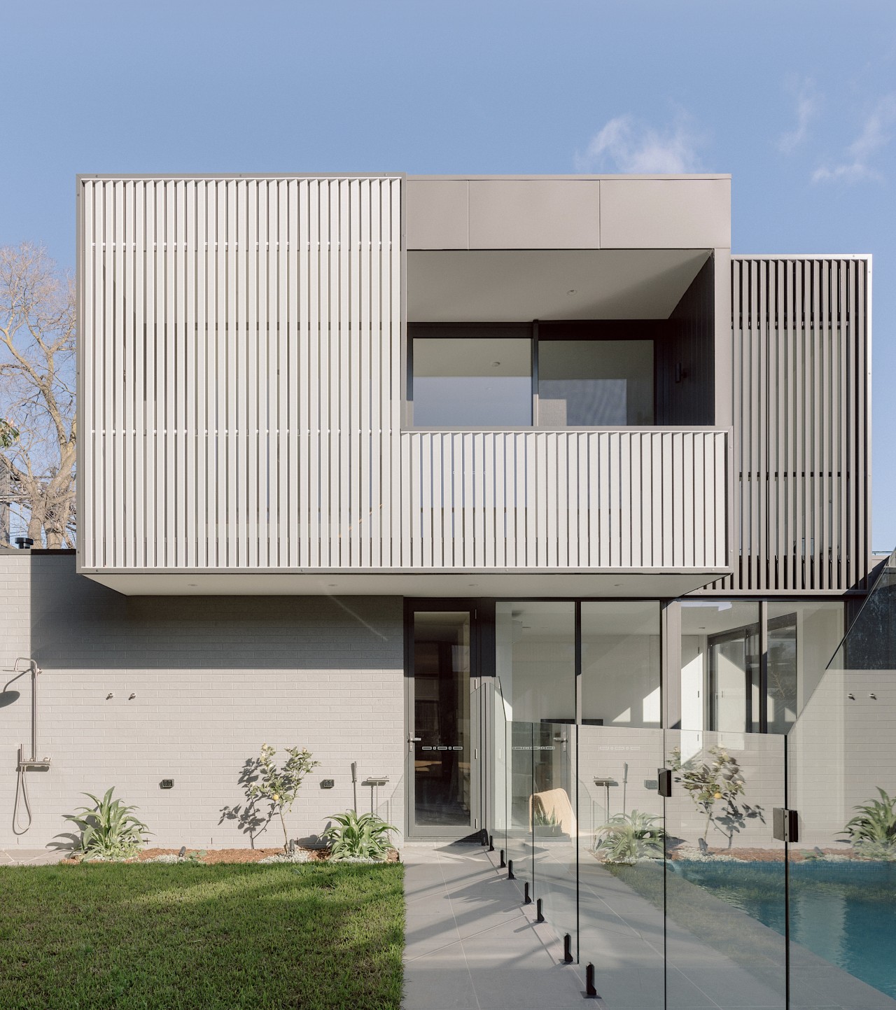 The decidedly contemporary rear facade. - Proud face, 