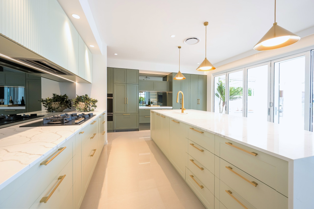 Soft, pale green cabinetry providing a light, ambient 