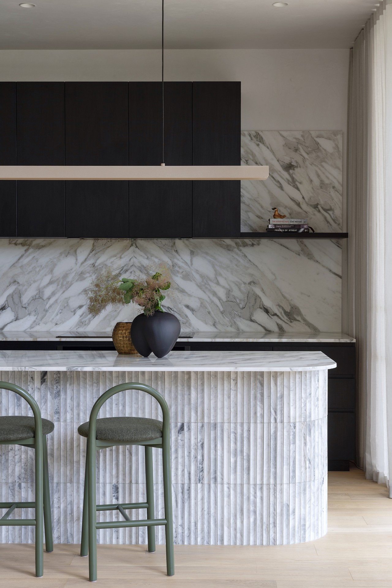 Feature island and splashback in Calacatta marble have 