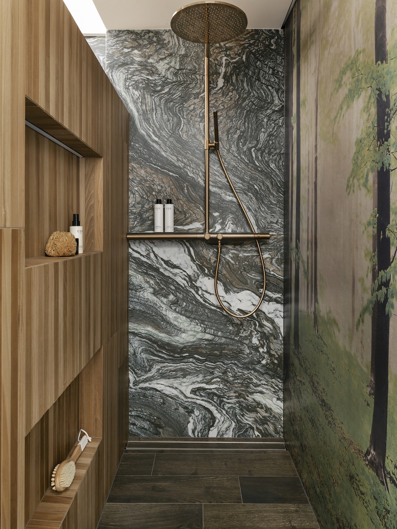 The shower enclosure coextends the patterned/natural materials vibe. 