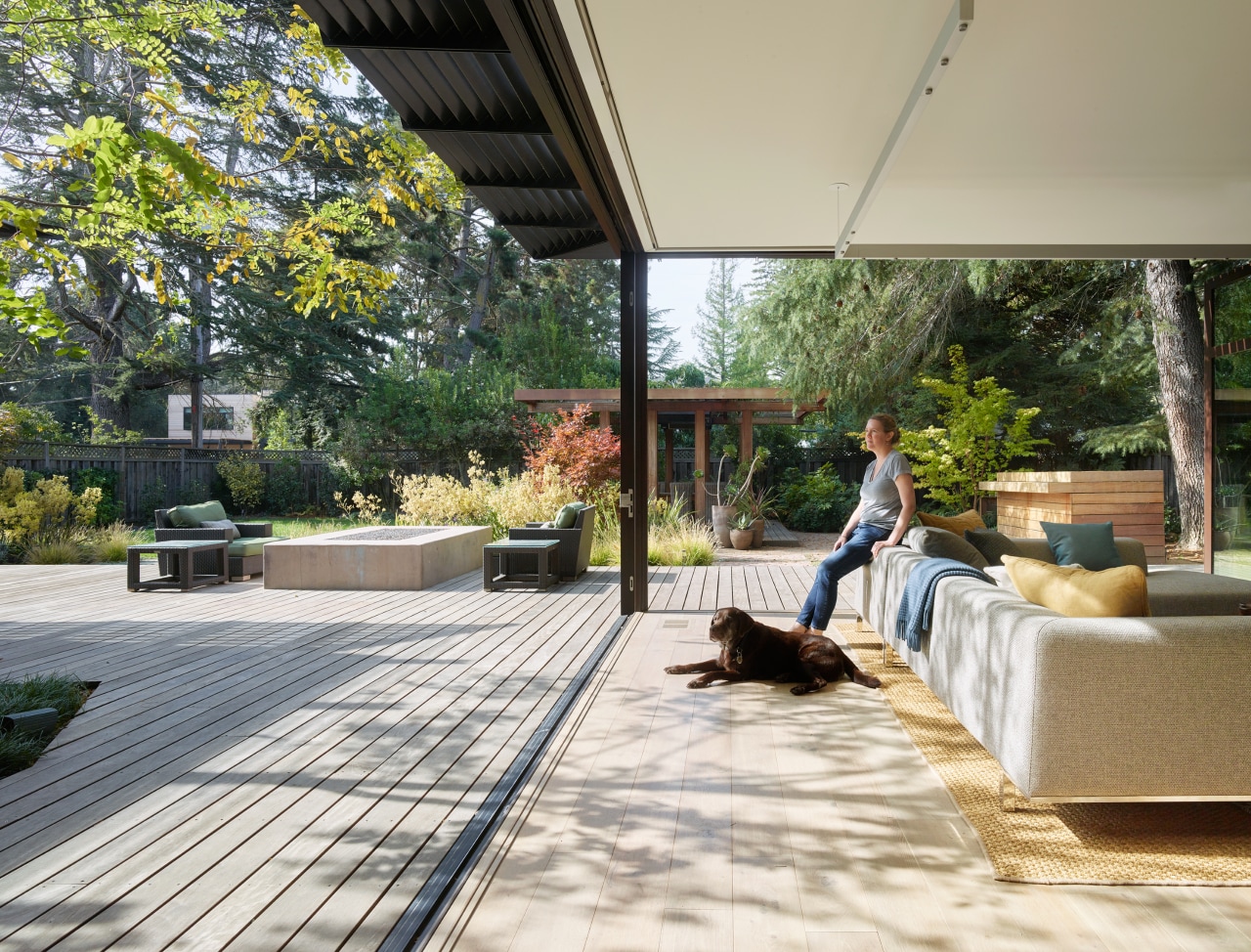 The generously-sized family room features accordion glass walls 