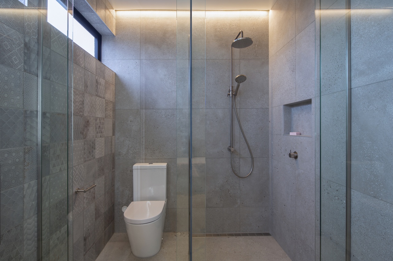 Glass toilet and shower stall surrounds add to 