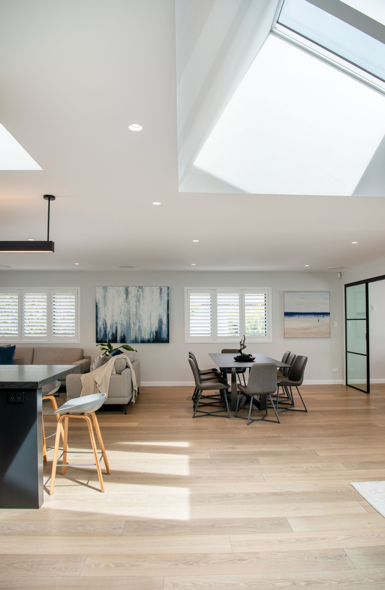 Pale wood floors add to the flowing feel 