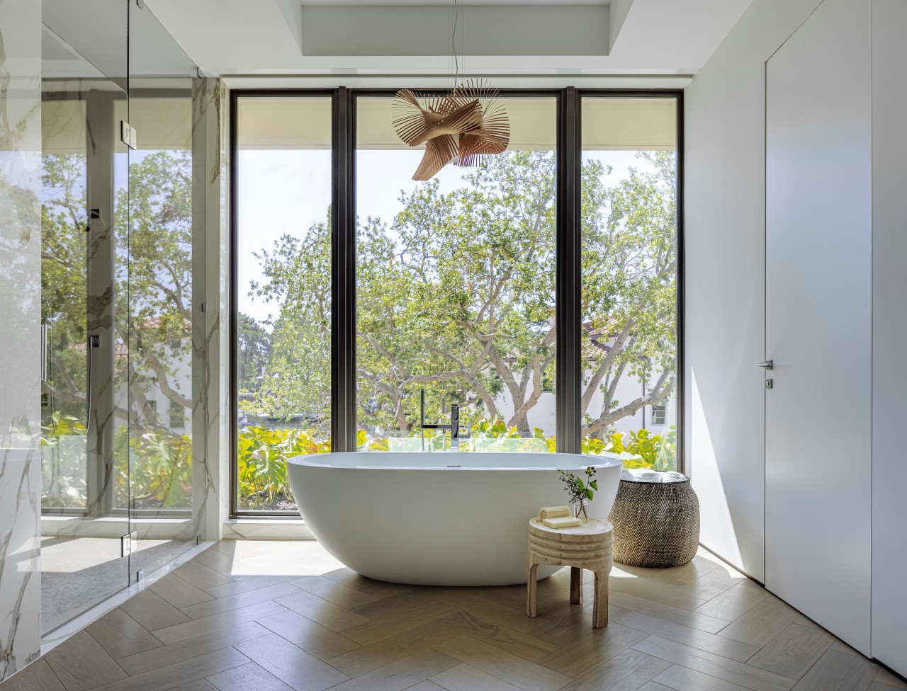 The primary bathroom highlights the freestanding statement tub 