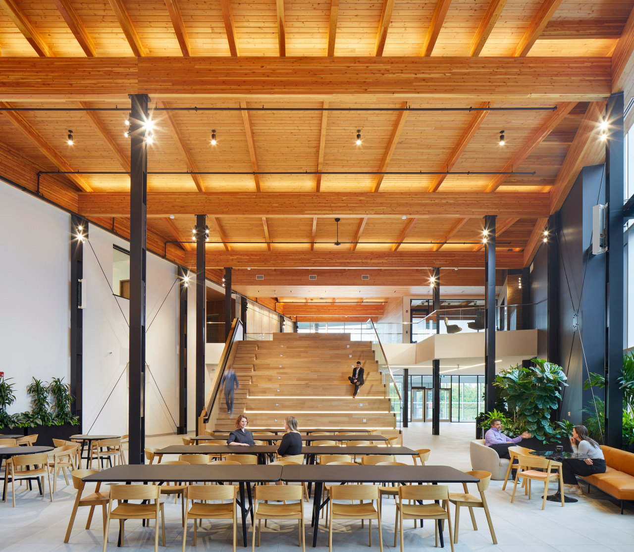 The design blends modern workplace elements with warm 