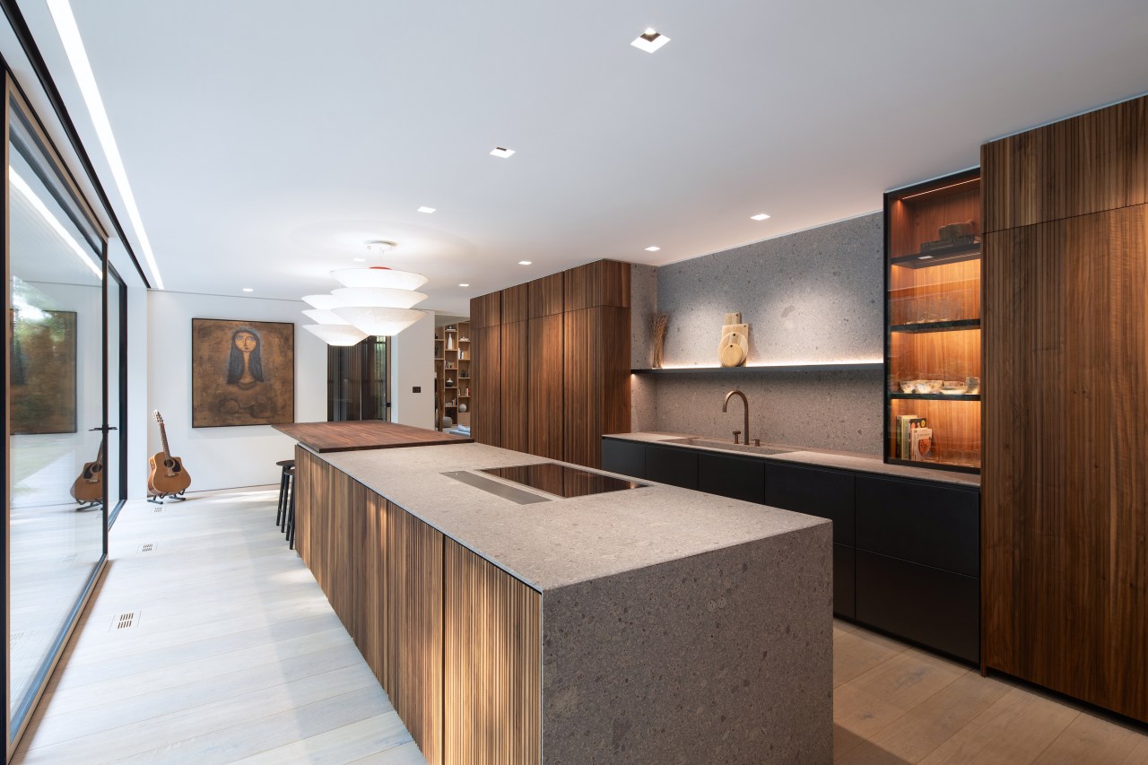 The expansive kitchen also celebrates wood and other 