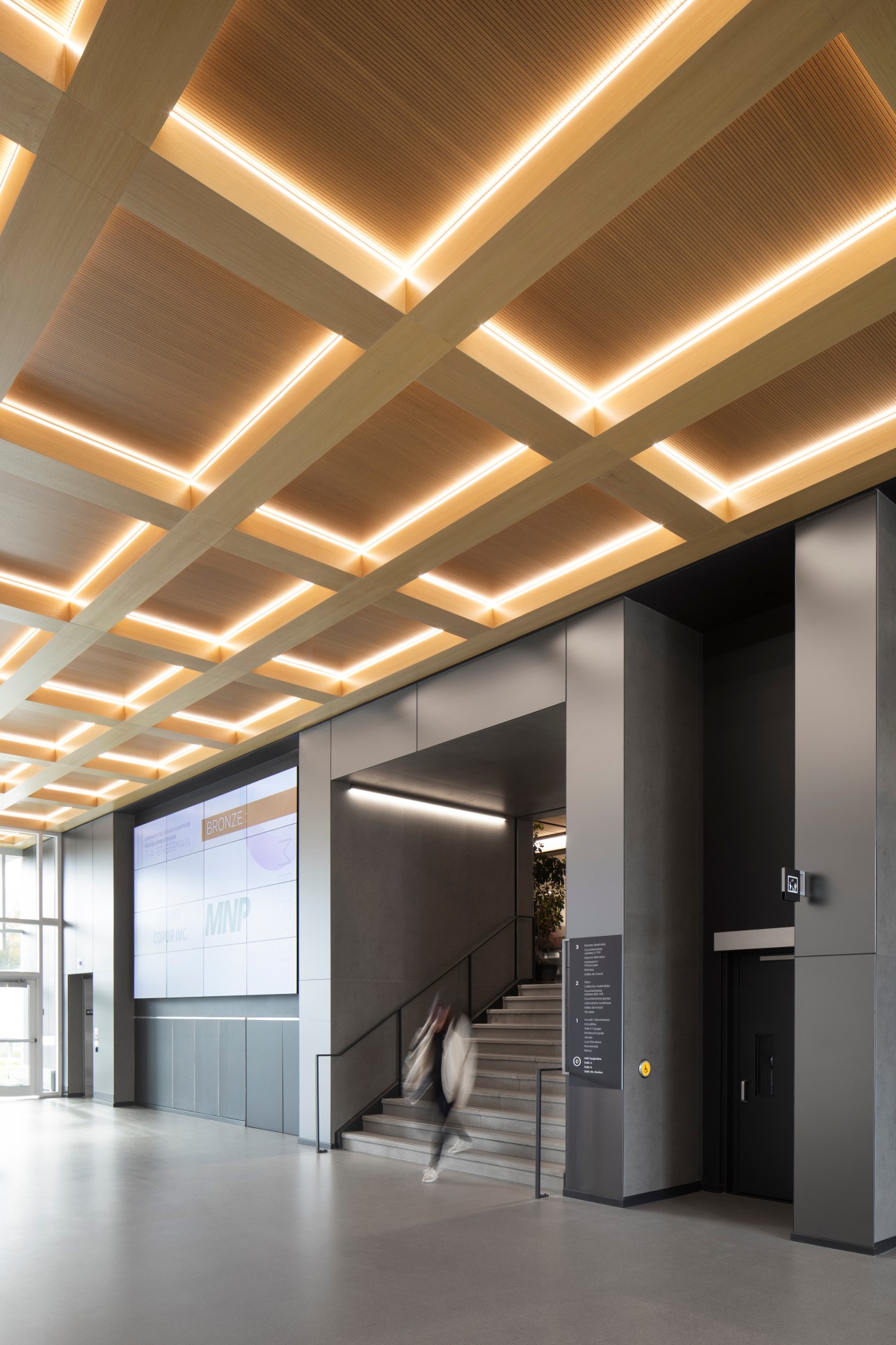 The extension's coffered wooden ceiling provides the whole 