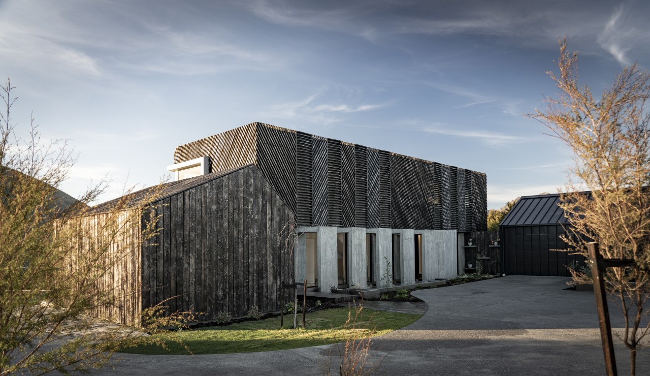 The wooden elements of this home's facade will gray