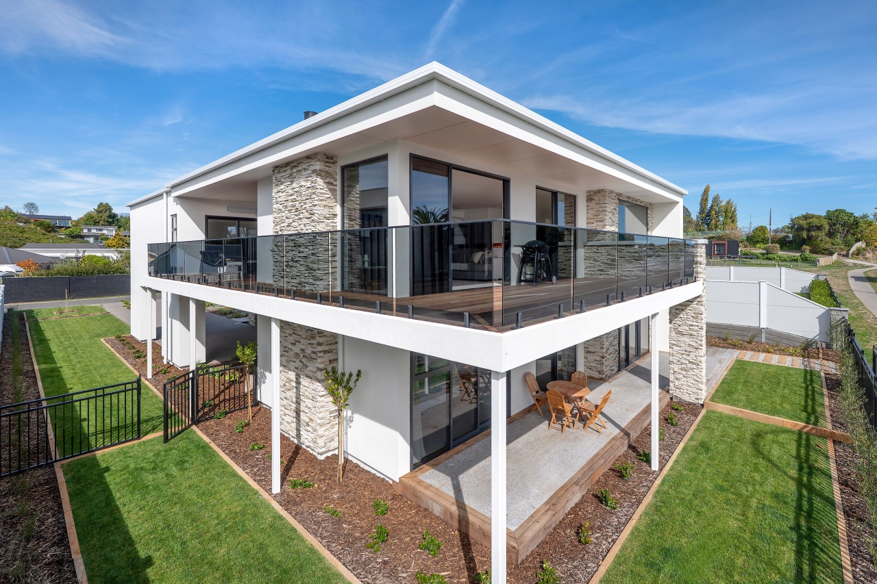 Decks upstairs and down embrace the spectacular lake 