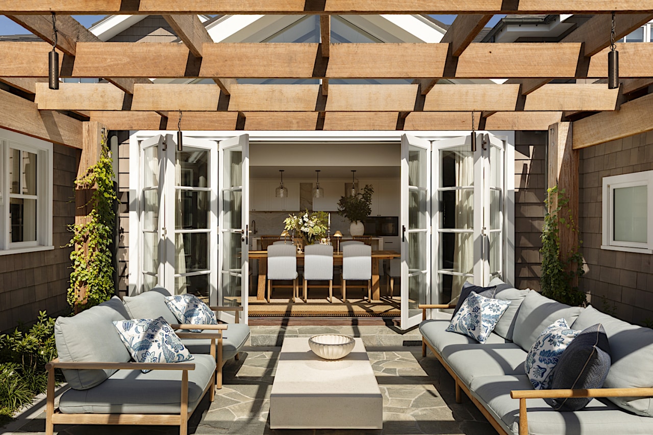 Outdoor living room with new pergola throwing attractive 