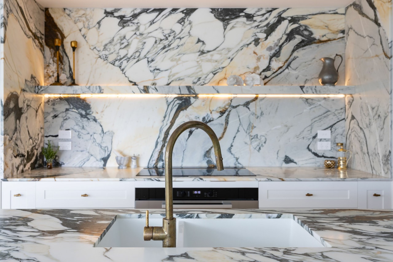 Marble shelving all but disappears into the regal 