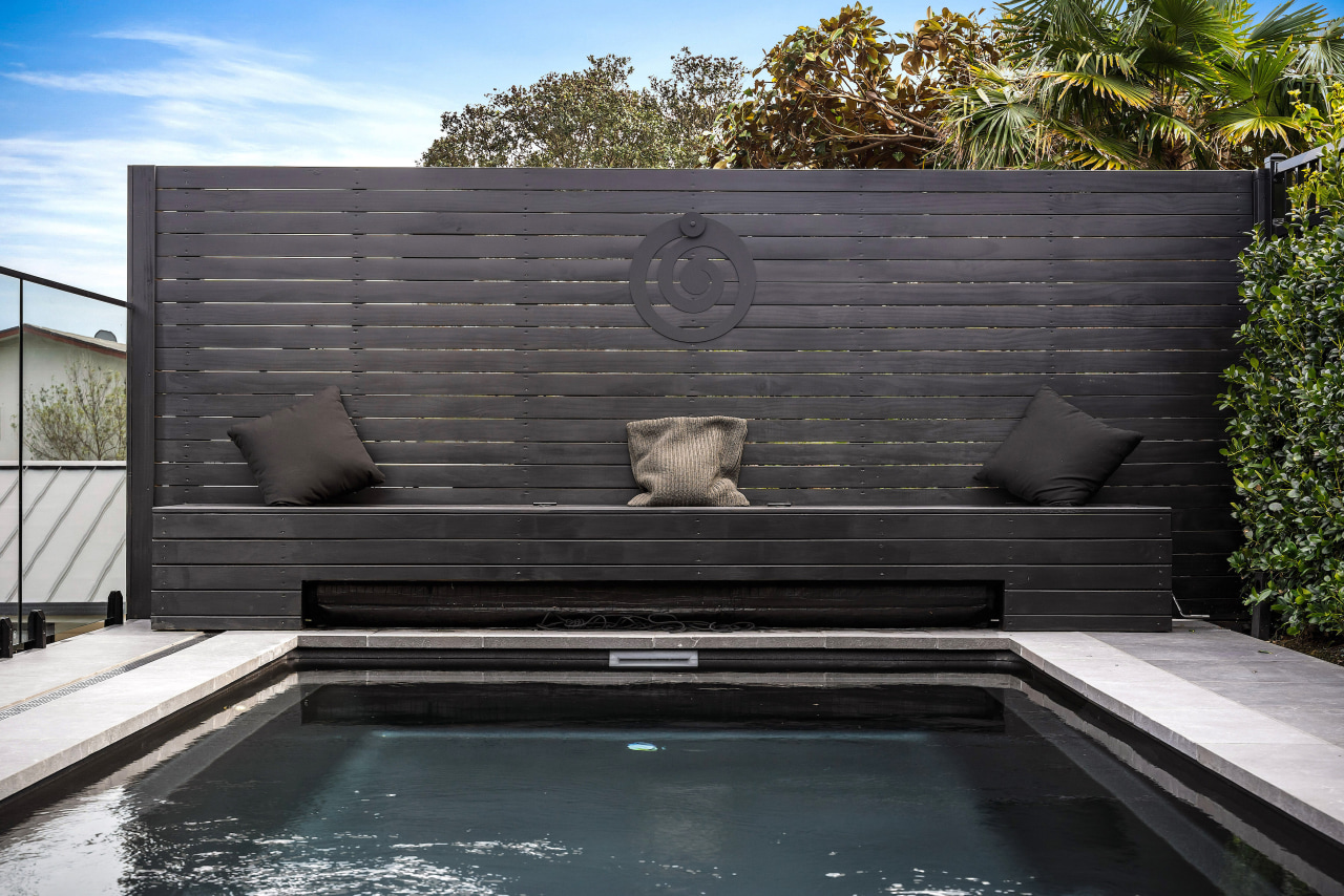 The wooden bench seat cleverly conceals the pool 