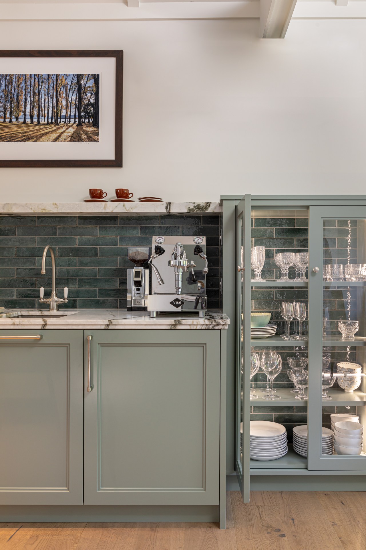 A glass fronted and open-backed cabinet shows off 