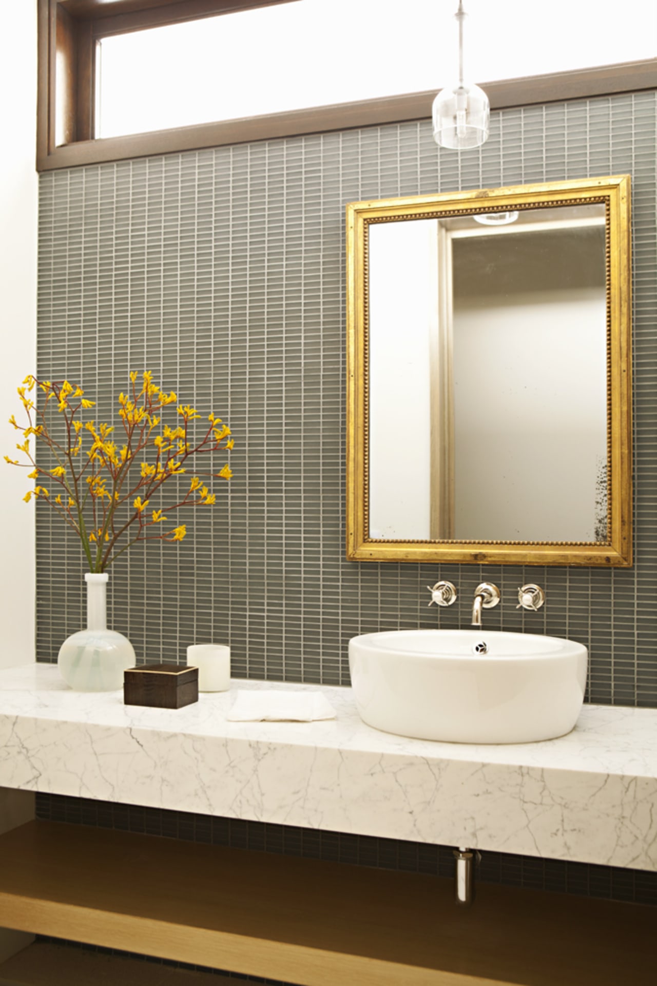 This first floor powder room combines understated high-end 