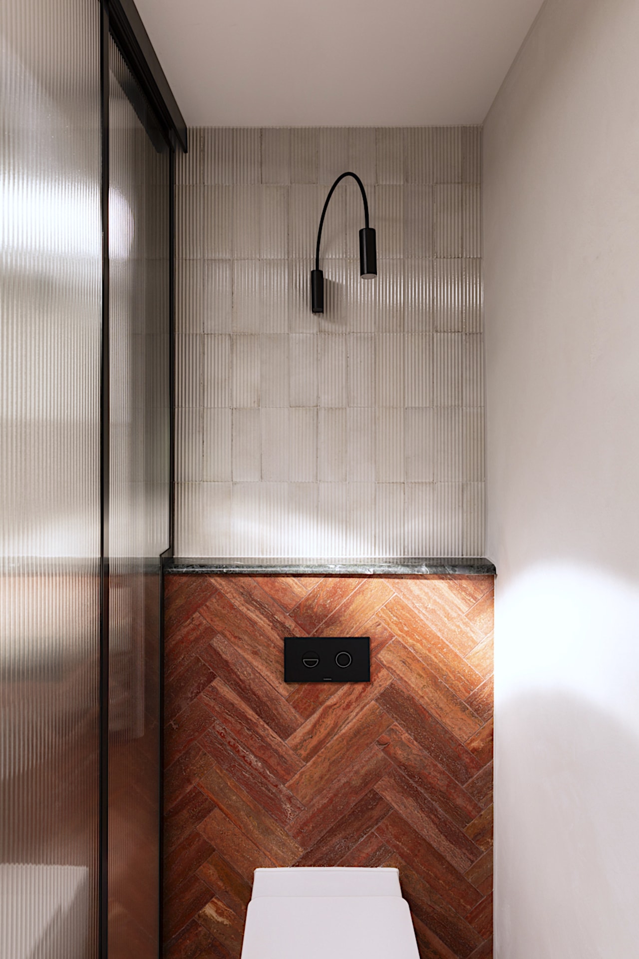 Exterior brickwork is echoed with the red travertine 