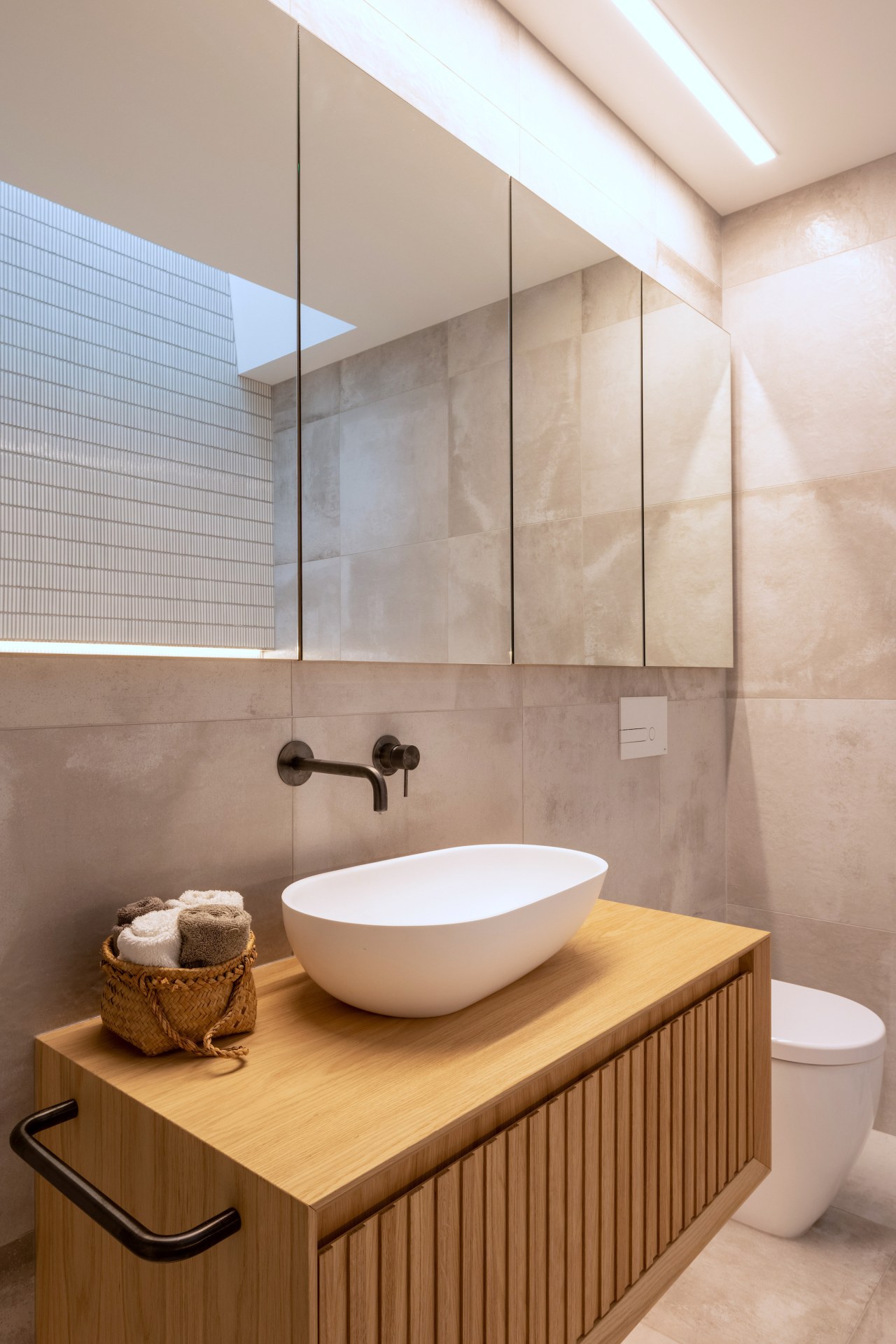 The natural timber veneer vanity with fluted fronts 