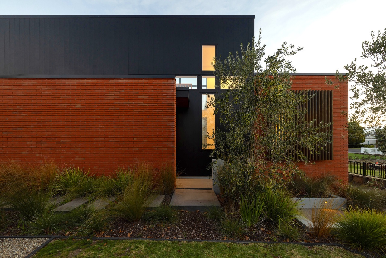Black NuWall and brick cladding create strong, striking 