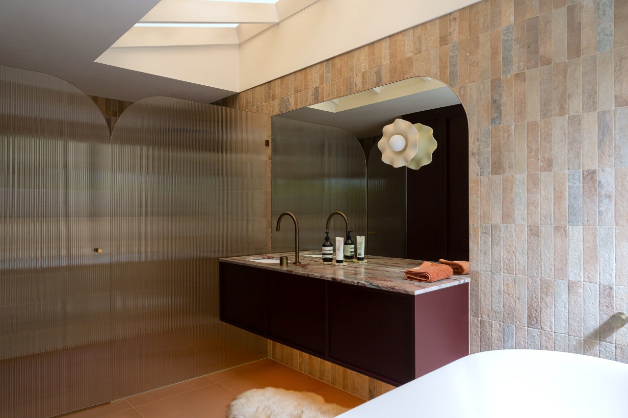 The palette for the bathroom is rich and 