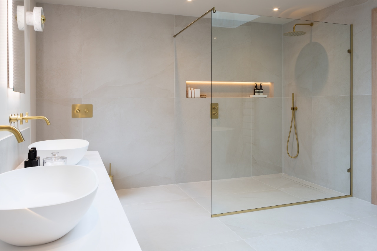 The transparent walk-in glass shower enclosure doesn't detract 